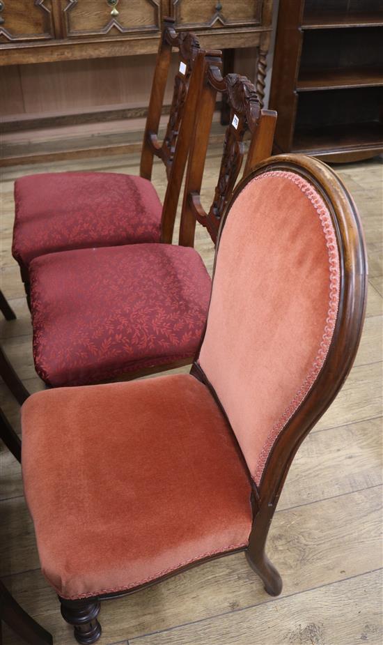 A pair of red whatnot chairs